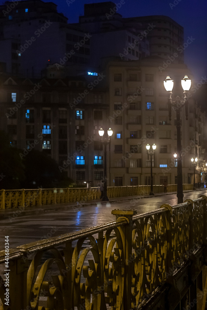 Blured of rainy night view of the iron grid of the Santa Ifigenia viaduct in downtown of Sao Paulo,