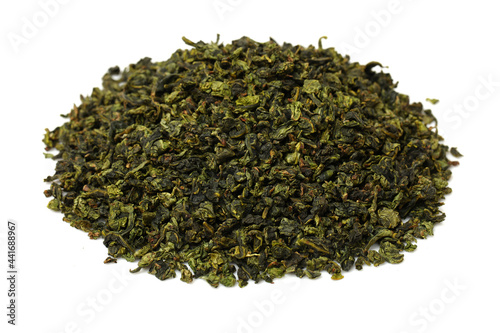  dry green tea leaves on white background 