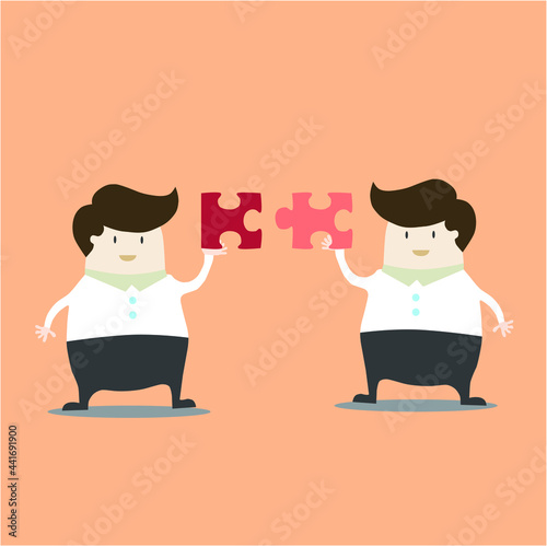 business people collaborate holding up jigsaw puzzle