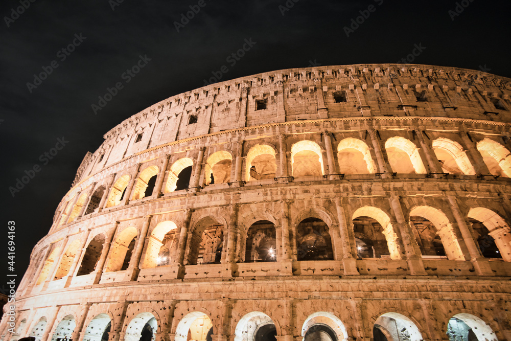 Colosseum in Rome int the night. travel directions and rest in Italy. Europe sightseeing landmarks and tourism