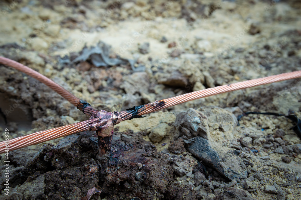 Welding copper ground wire on ground rod.Welding copper ground wire