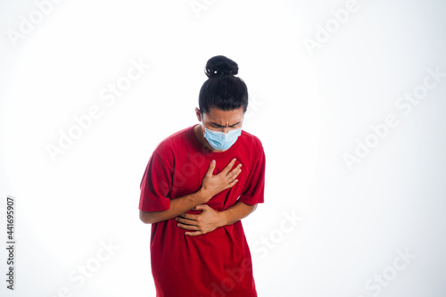 Covid19, the concept of health care and medicine. A young man standing in a face mask with hand gesture 