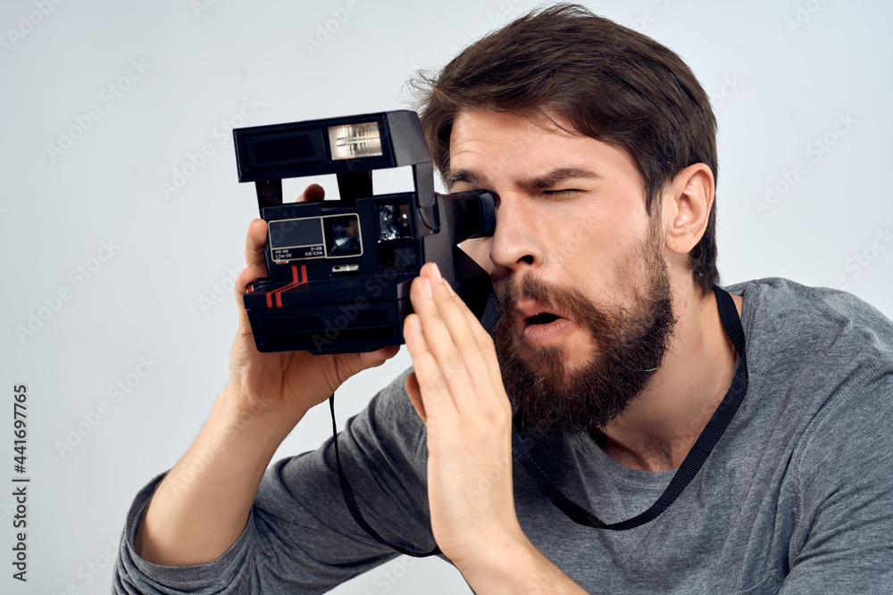 bearded man with a camera in his hands photographers professional hobby bearded man with a camera in his hands photographers professional hobby
