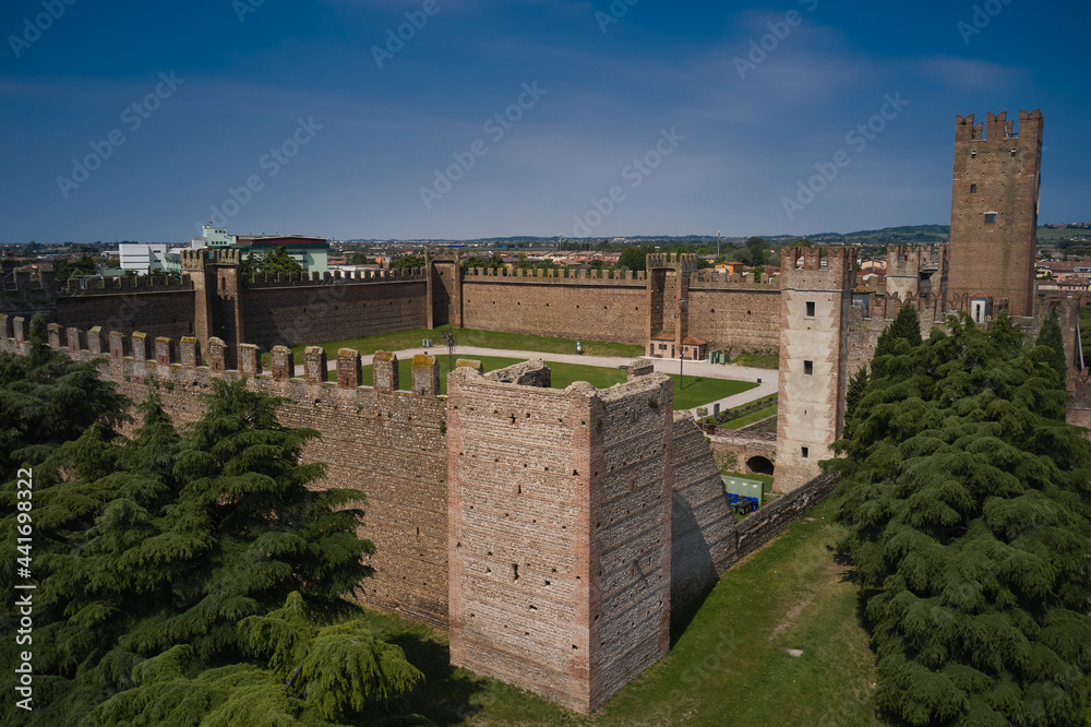 Historical part of the city Villafranca di Verona, Verona, Italy. Aerial view of the Italian historic castle Castello Scaligero, view of the Villafranca di Verona.