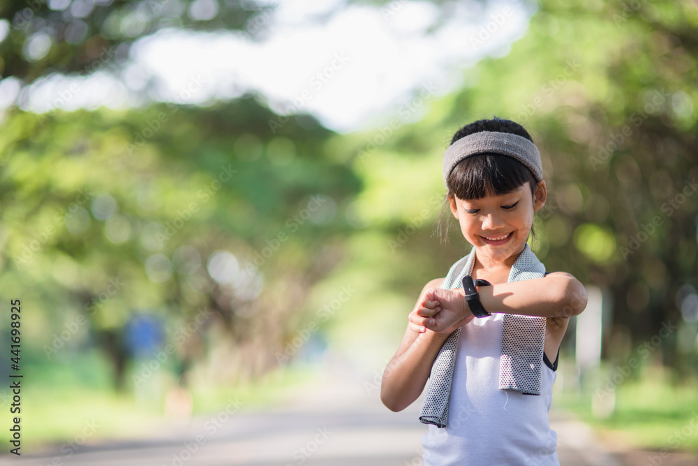 happy child girl running in the park in summer in nature. warm sunlight flare. asian little is running in a park. outdoor sports and fitness, exercise and competition learning for kid development. happy child girl running in the park in summer in nature. warm sunlight flare. asian little is running in a park. outdoor sports and fitness, exercise and competition learning for kid development.