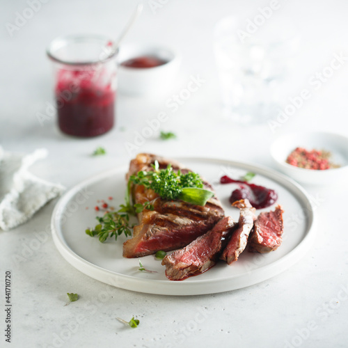 Grilled beef steak with herbs