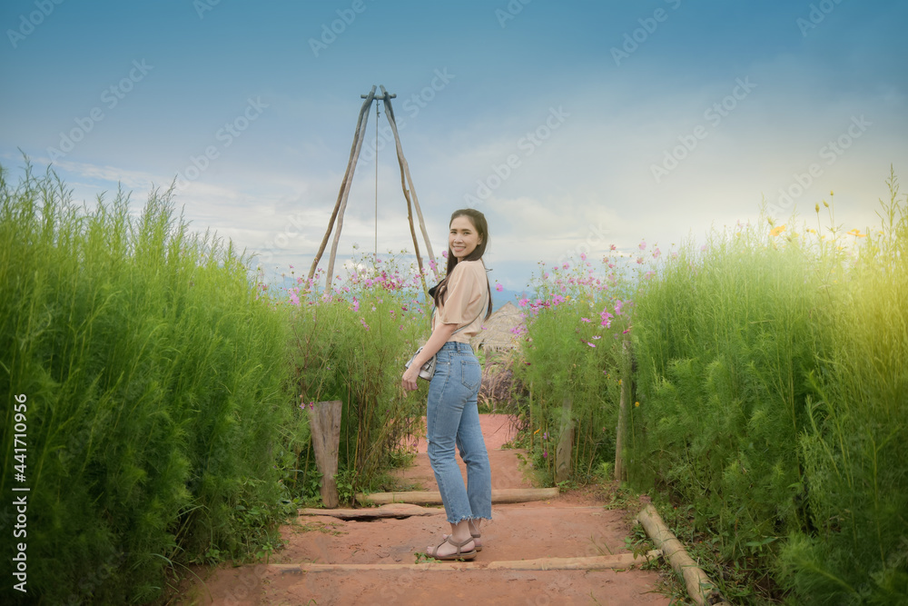 woman standing in green filed nature travel in summer woman standing in green filed nature travel in summer