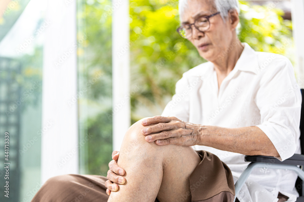 Close up,Leg of senior aged having pain in her knee,massage the kneecap
