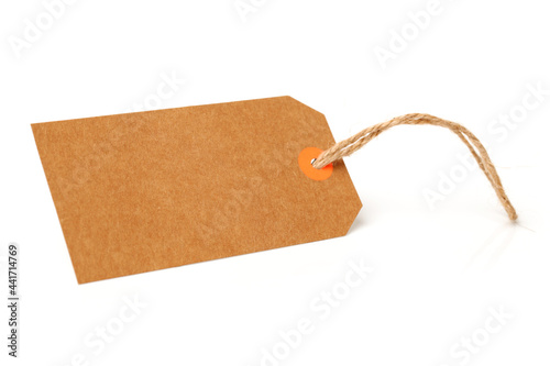Blank tag tied with string. Price tag, gift tag, sale tag, address label on white background