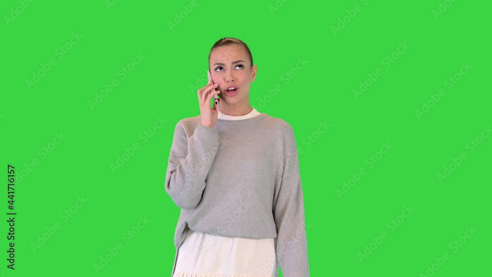 Stylish casual girl walking and calling on a Green Screen, Chroma Key. Stylish casual girl walking and calling on a Green Screen, Chroma Key.