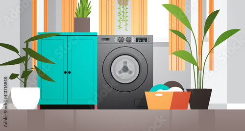interior of laundry room with washing machine electric washer home appliance concept horizontal