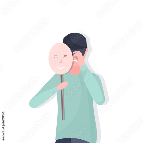 depressed man holding positive mask guy covering face emotions behind mask fake feeling