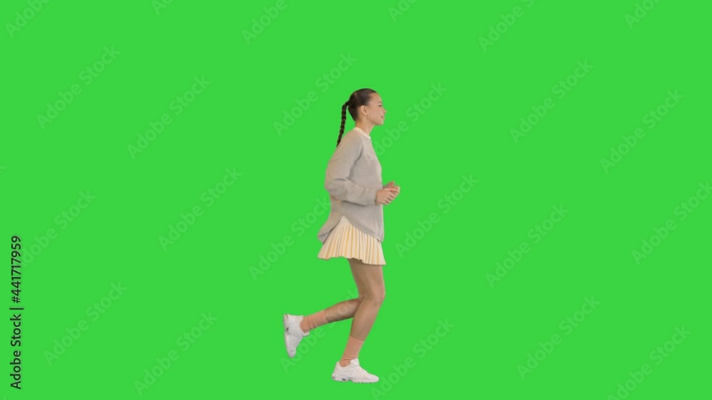 Happy healthy sporty girl running on a Green Screen, Chroma Key. Happy healthy sporty girl running on a Green Screen, Chroma Key.