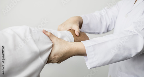 A professional physiotherapist is doing stretching for a patient, the patient has muscle dysfunction due to hard work, most often an office worker who has problems sitting for long periods of time.