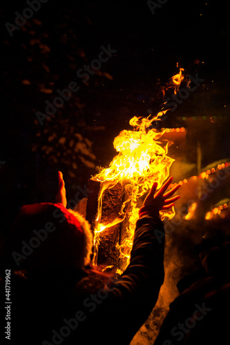 Silhouette of a man by the fire at night. High quality photo