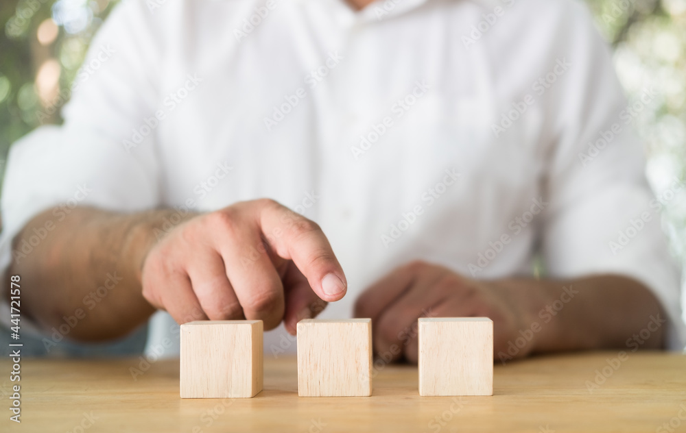 Businessman hand point to wood block, empty blank wood block for your design. Businessman hand point to wood block, empty blank wood block for your design.