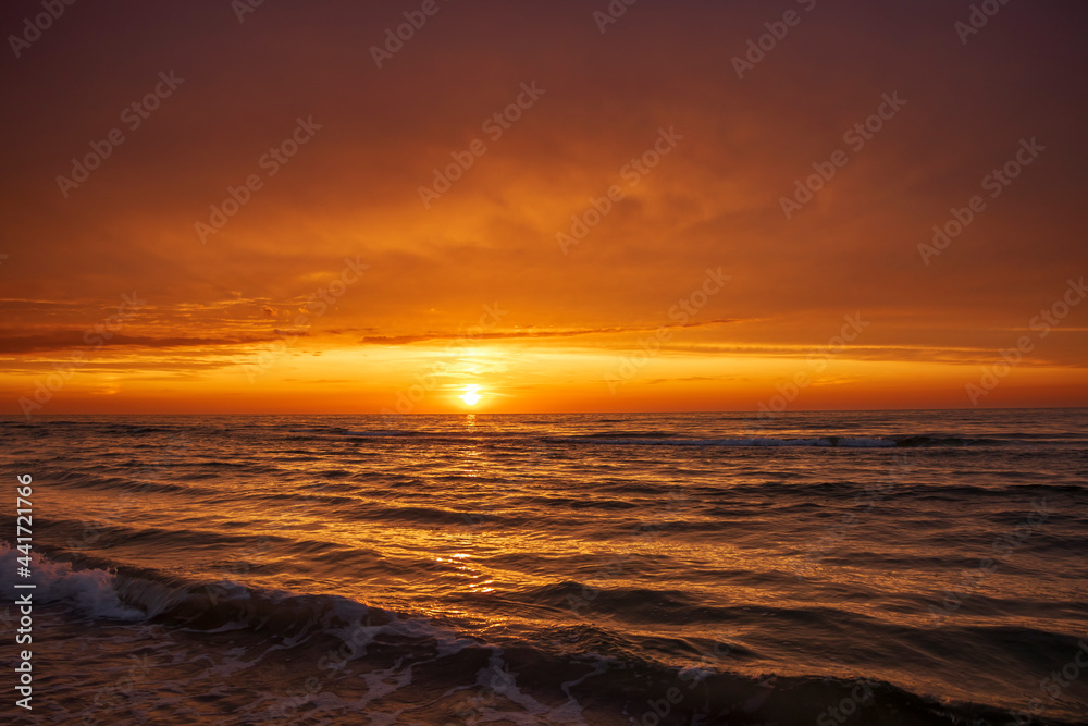 Orange sunset on the Baltic Sea in Leba