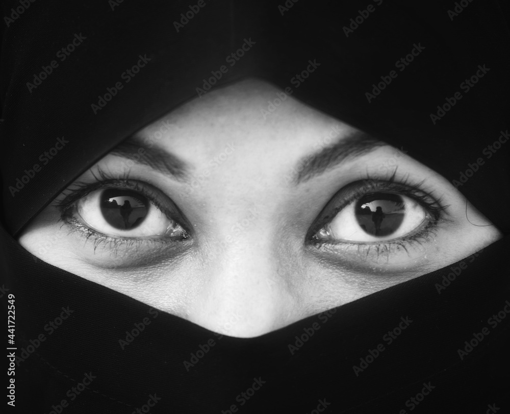 Closeup of beautiful woman face covered with hijab. Perfect shiny eyes of a Muslim girl. Young niqab girl portrait. Closeup of beautiful woman face covered with hijab. Perfect shiny eyes of a Muslim girl. Young niqab girl portrait.