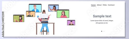 businesswoman chatting with mix race colleagues in web browser windows during video call online conference