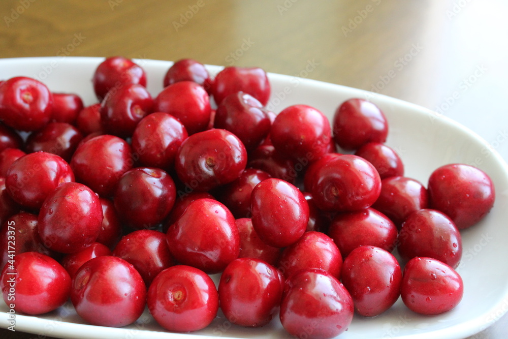 fresh cherry fruits in a bowl on table, summer fruits fresh cherry fruits in a bowl on table, summer fruits