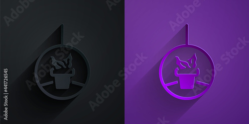 Paper cut Plant in hanging pot icon isolated on black on purple background. Decorative macrame handmade hangers for flower pot, hang indoor plants. Paper art style. Vector
