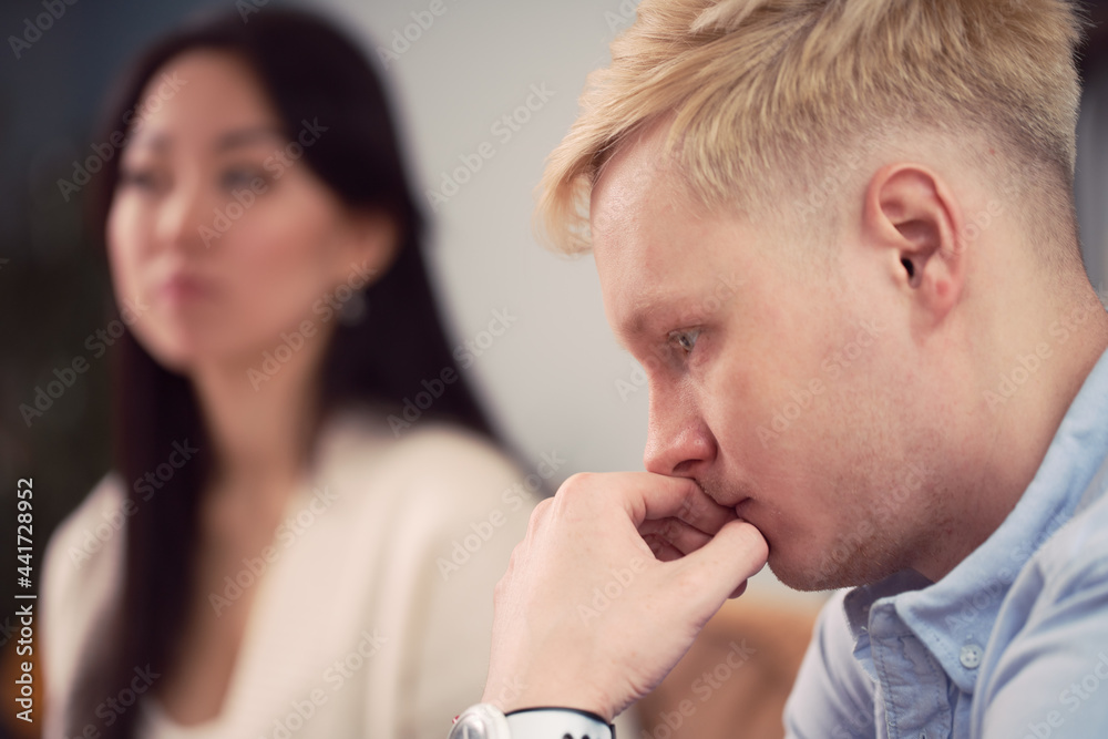 Multiracial couple having argument during psychotherapy session Multiracial couple having argument during psychotherapy session