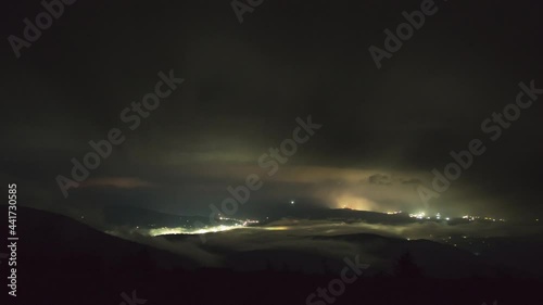 Starry sky, fog, clouds and rain, a village in the Ukrainian carpathians, night landscape, timelapse