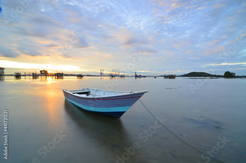 Boat fishing in a beautiful sunset time in one of Batam island fishing village 