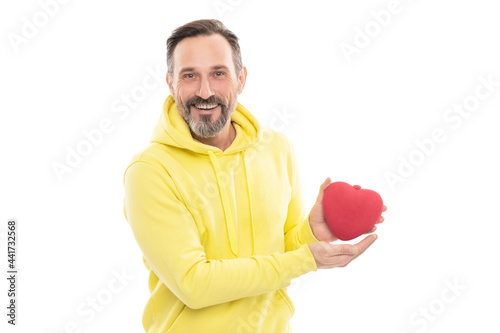 mature happy man with heart shape box. smiling senior guy hold present isolated on white.