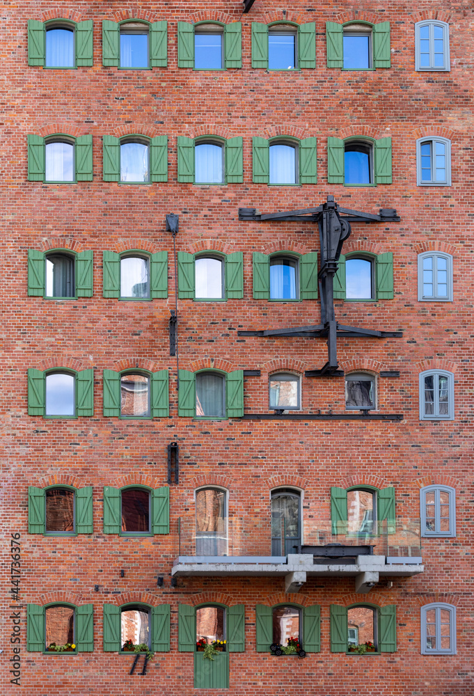 Facade of restored medieval granary on the Granary island in the old town of Gdansk . Poland