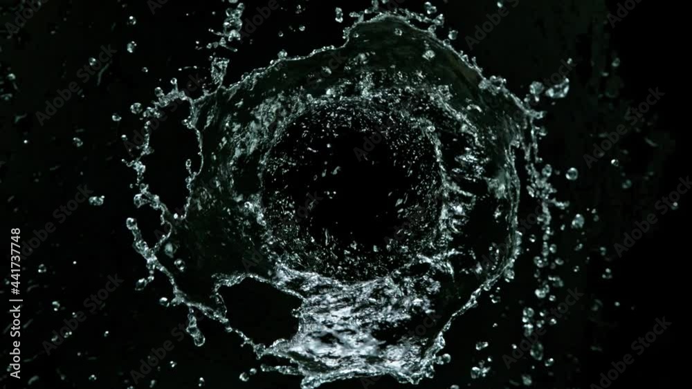 Super slow motion of rotating water on black background. Filmed on high speed cinema camera, 1000 fps.