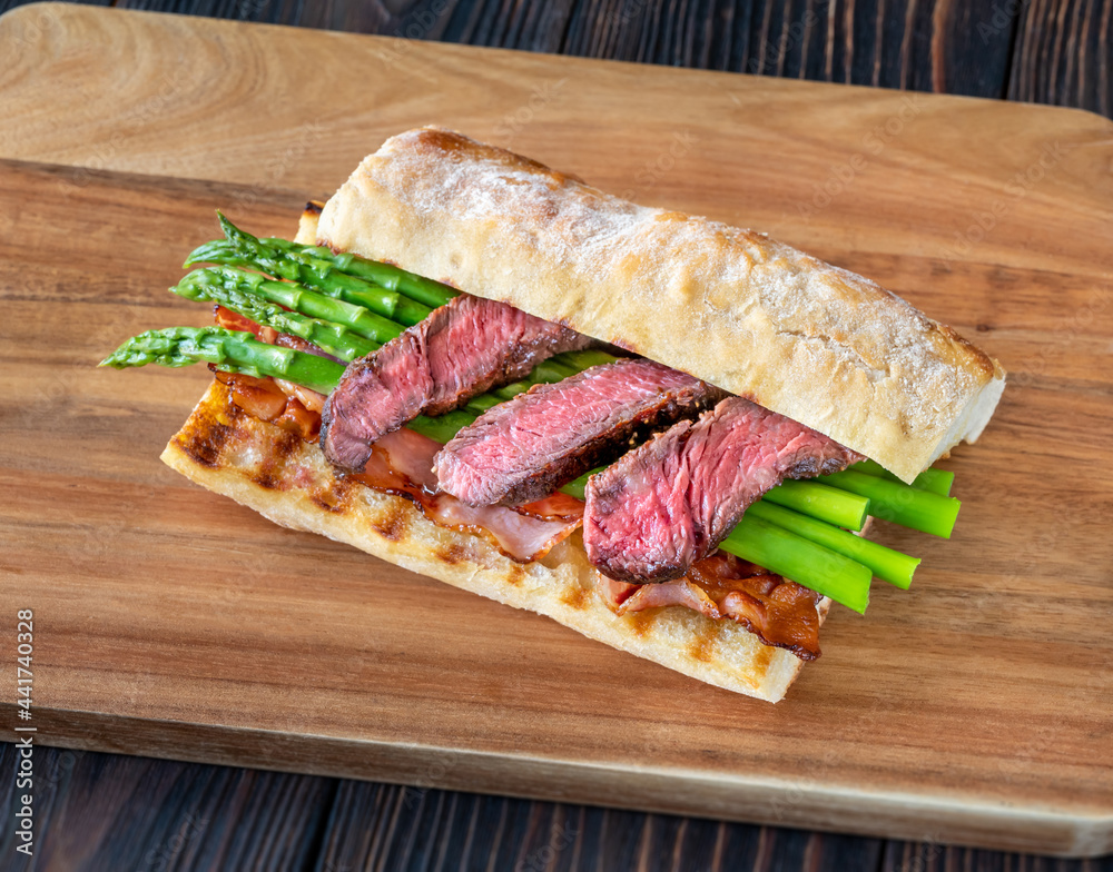 Sandwich with asparagus and slices of beef steak Sandwich with asparagus and slices of beef steak