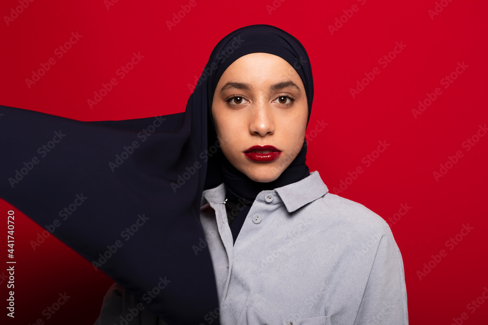 Muslim woman wearing stylish headscarf in studio Muslim woman wearing stylish headscarf in studio