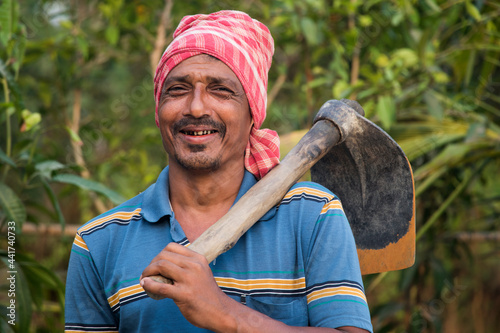 Portrait of a Farmer holding a Shovel photo