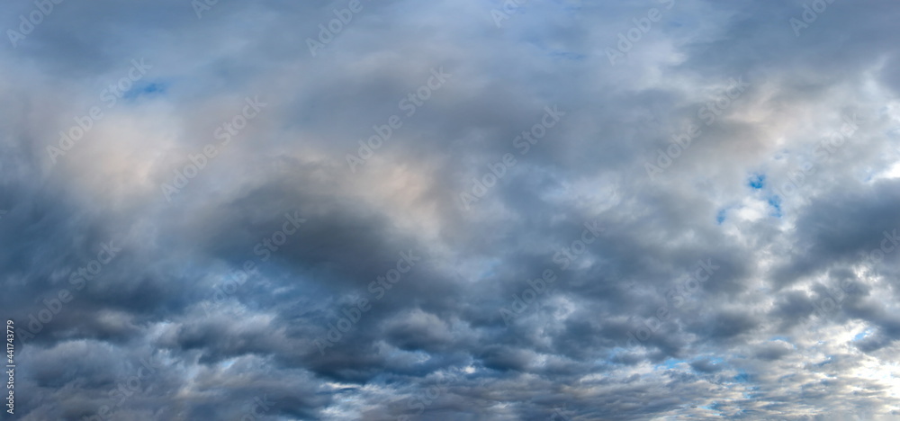 Russia. The South of Western Siberia. Gloomy sunset clouds in the evening summer sky over the fields of Altai.