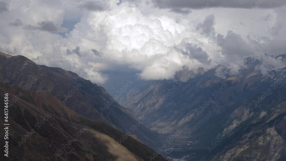 4k time-lapse video of the current of clouds and changes in the weather in the mountains in spring. Altogether cumulus clouds change. Mountain weather concept