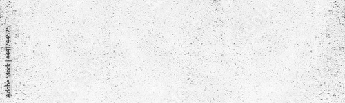 Whitewashed exposed aggregate concrete panoramic texture. Old white rough cement wall. Abstract light grey wide background photo
