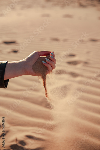 young girl hands playing with some sand