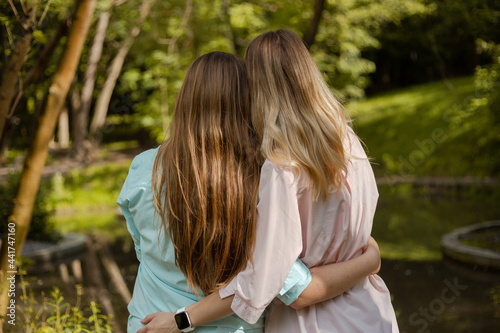 girls hugging yeach other at park