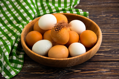 raw eggs on wooden background