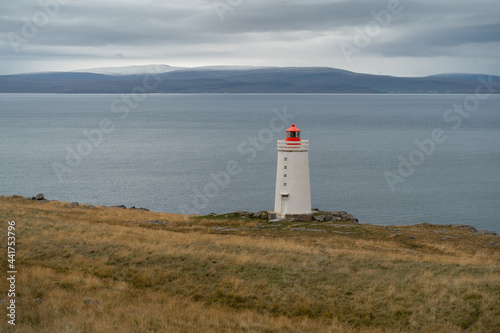 Lighthouse on the cliff near the ocean in Northwest Iceland