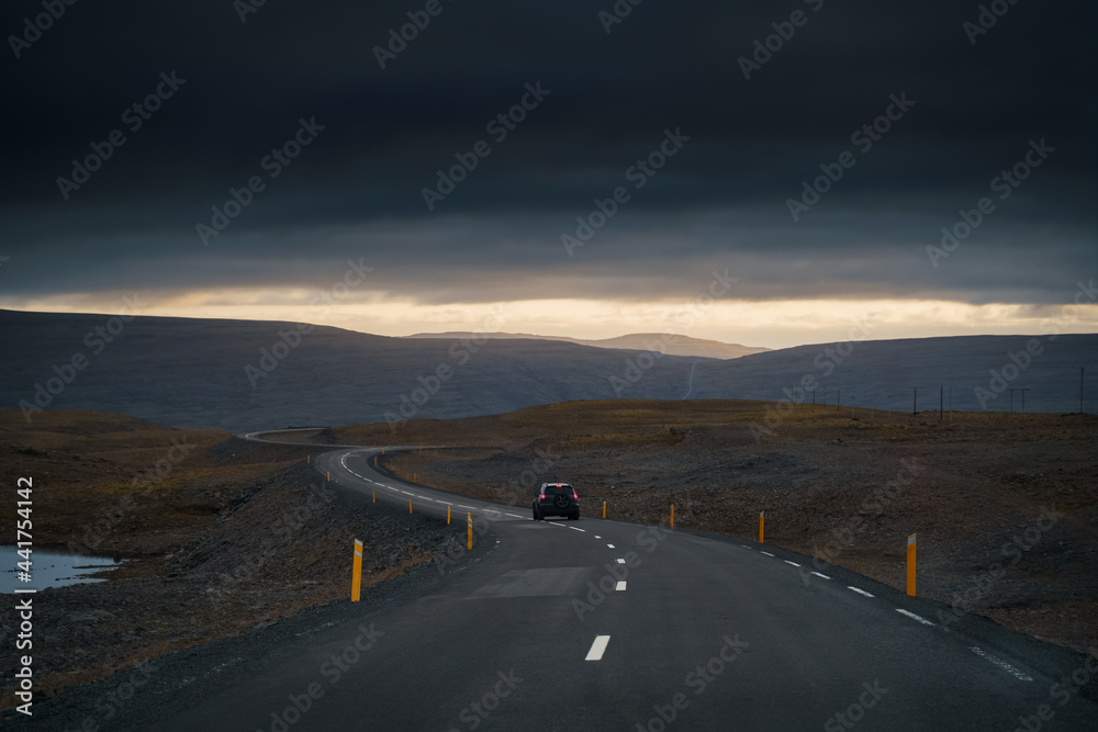 Drive car on road. Iceland travel. View from the inside. Beautiful nature icelandic landscape in the dusk