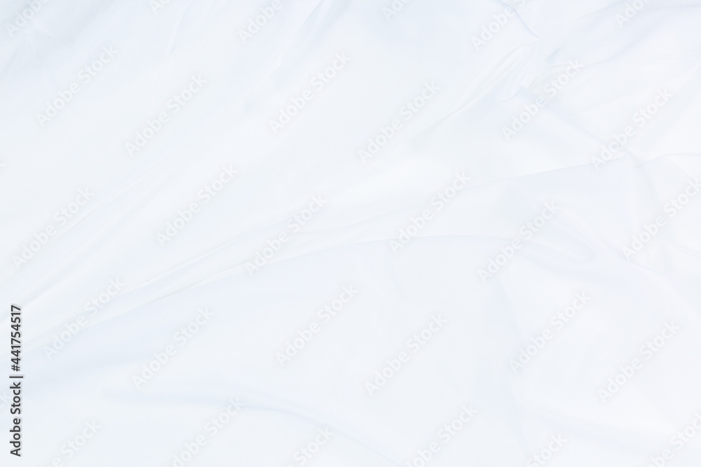 White cloth background abstract with soft waves,Closeup elegant crumpled of white silk fabric cloth background and texture. Luxury background design. White cloth background abstract with soft waves,Closeup elegant crumpled of white silk fabric cloth background and texture. Luxury background design.