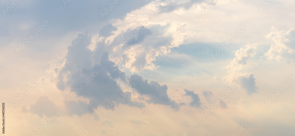A view of clouds and sunlight shining through during the day. A view of clouds and sunlight shining through during the day.