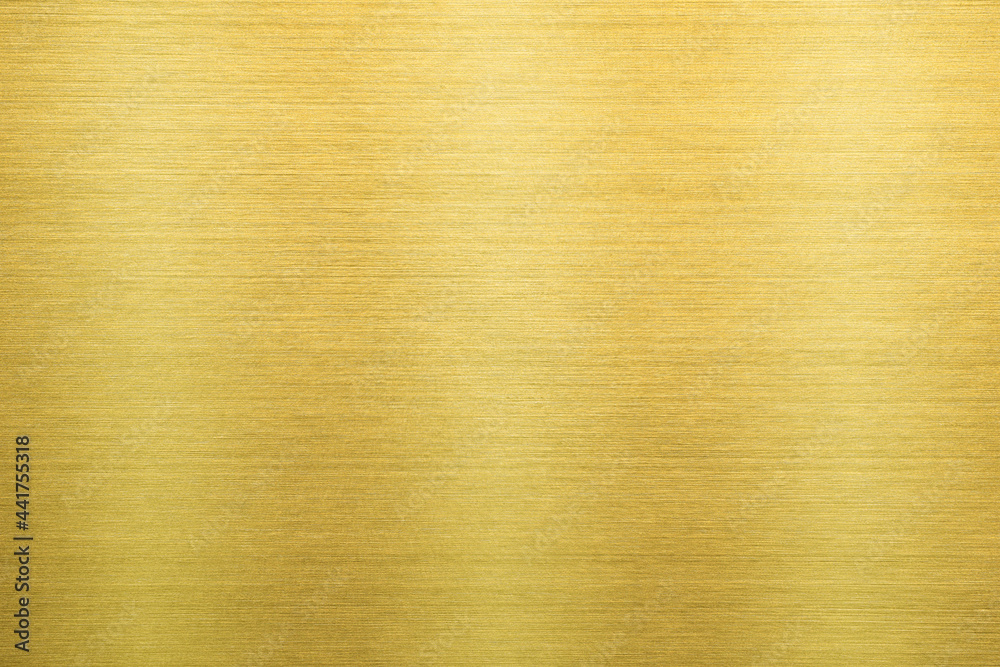 Shiny gold polished metal background texture of brushed stainless steel plate with the reflection of light. Shiny gold polished metal background texture of brushed stainless steel plate with the reflection of light.