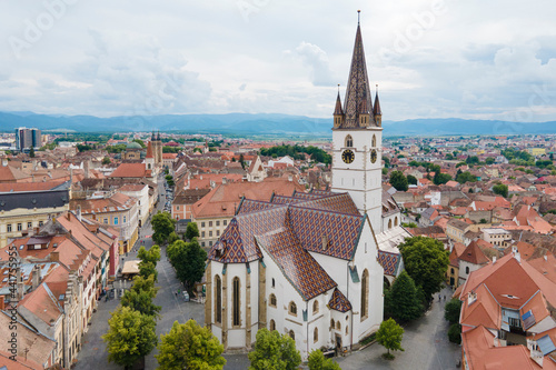Aerial view of ancient part of Sibiu in Romania, red roofs town in summer day photo