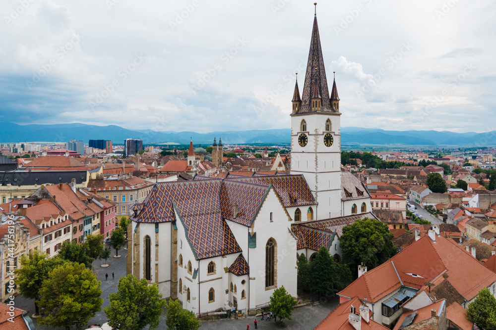 Aerial view of ancient part of Sibiu in Romania, red roofs town in summer day