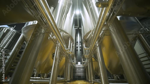 Modern craft brewery. Craft beer production. Modern equipment in brewery, metal tanks, alcoholic drink production