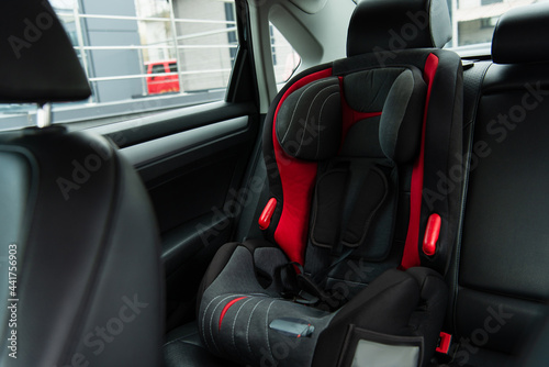 modern comfortable baby chair inside modern car © LIGHTFIELD STUDIOS