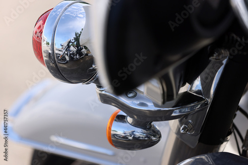 Close up shot reflection of Motor Cycle Road Trip background Street . Big Bikes with Copy Space. Design Retro Style Selective Focus. photo